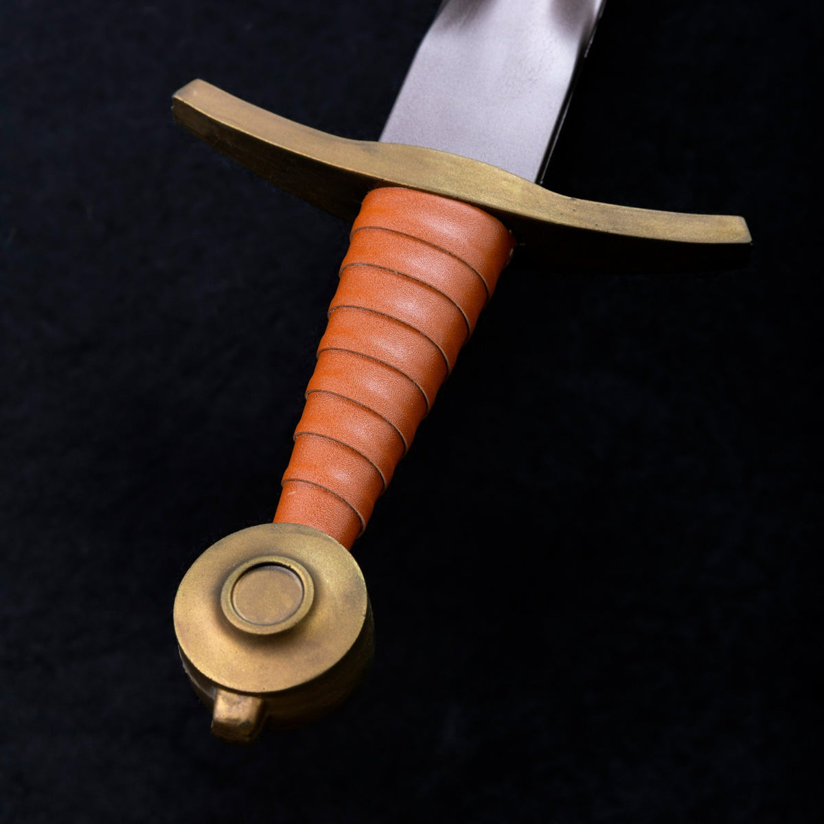 Larp Foam Sword with orange handle and brass guard on a black background