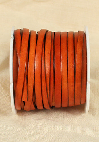 Correa trenzada de cuero de grano completo en naranja de 25 mm.