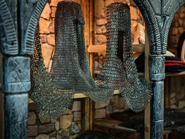 Chainmail shirt hanging on a stone archway